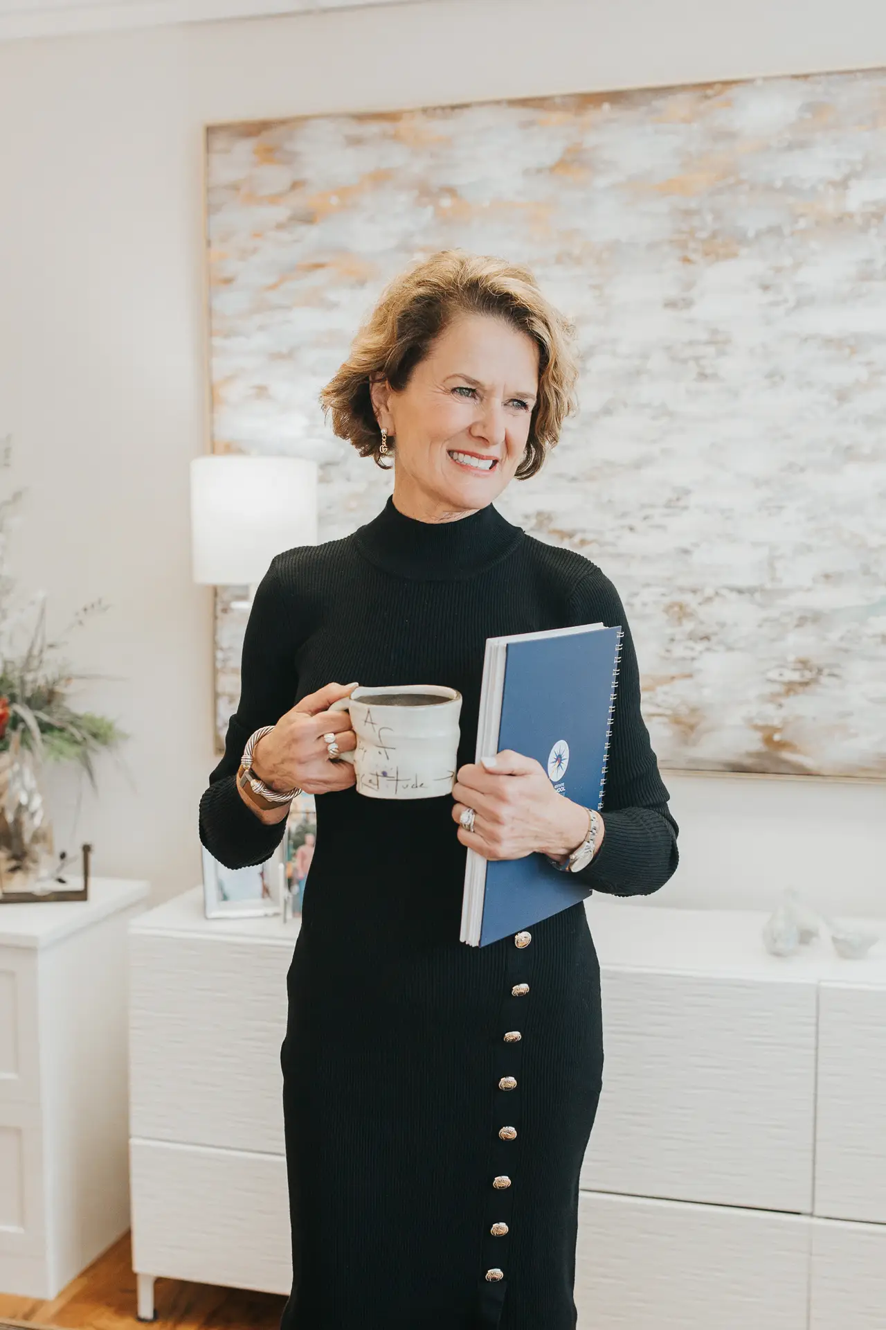 Melissa Thompson with coffee and folder, ready for a productive morning